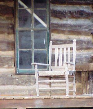 This photo of a rustic log cabin ... a setting where you might expect to find various types of rustic antiques ... was taken by Loretta Humble of Malakoff, Texas. 